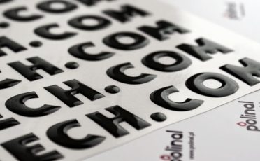 The logo on the 3D domed label