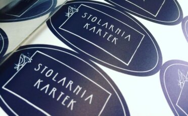 Matte black elliptical labels with logo